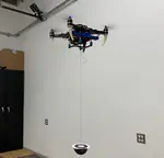 PCMPC: Perception-Constrained Model Predictive Control for Quadrotors with Suspended Loads using a Single Camera and IMU